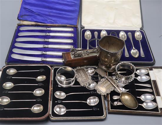 A quantity of assorted silver including boxed cutlery, wine labels, napkin rings etc.